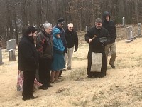 Fr. John begins to bless the graves