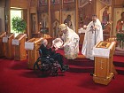 Bishop Nikon presents Gramata to Protodeacon Simeon